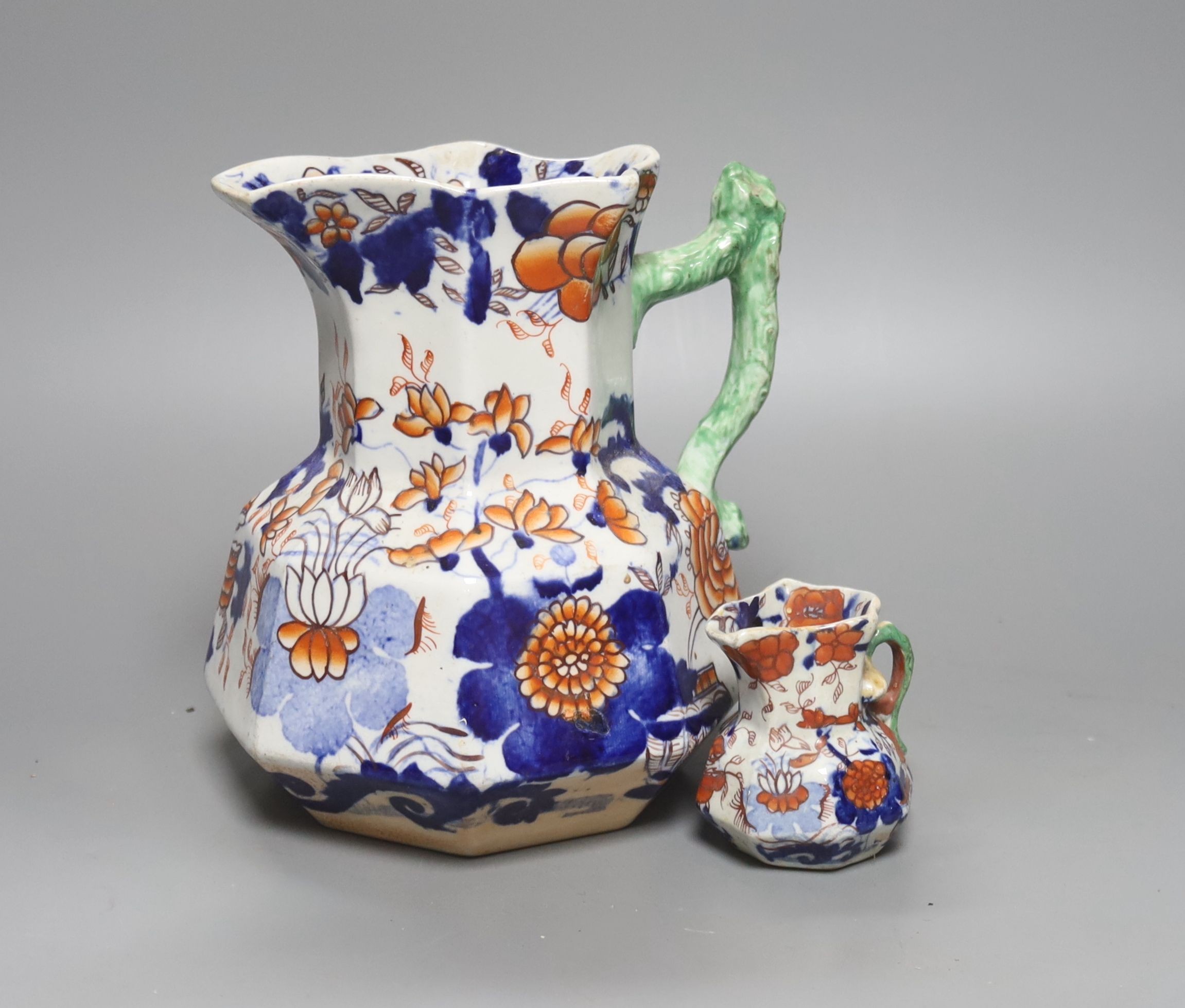 A graduated set of eight Mason's floral Imari pattern ironstone hydra jugs, c.1820-30, largest 19cm smallest 7cm and two other Mason’s ironstone jugs (10)